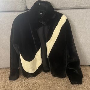 New Nike. 100% polyester. Black and white. XS jacket. Super soft, fluffy jacket